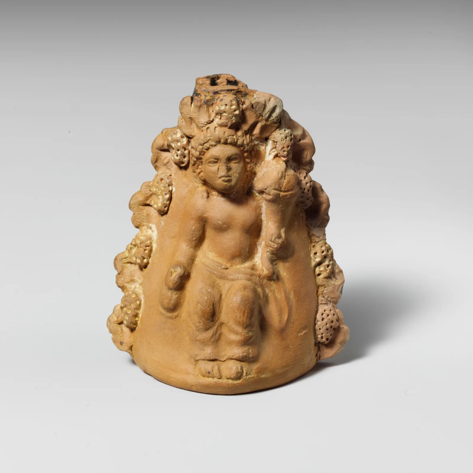 Terracotta oinochoe (jug) with a seated boy, Greek, Attic