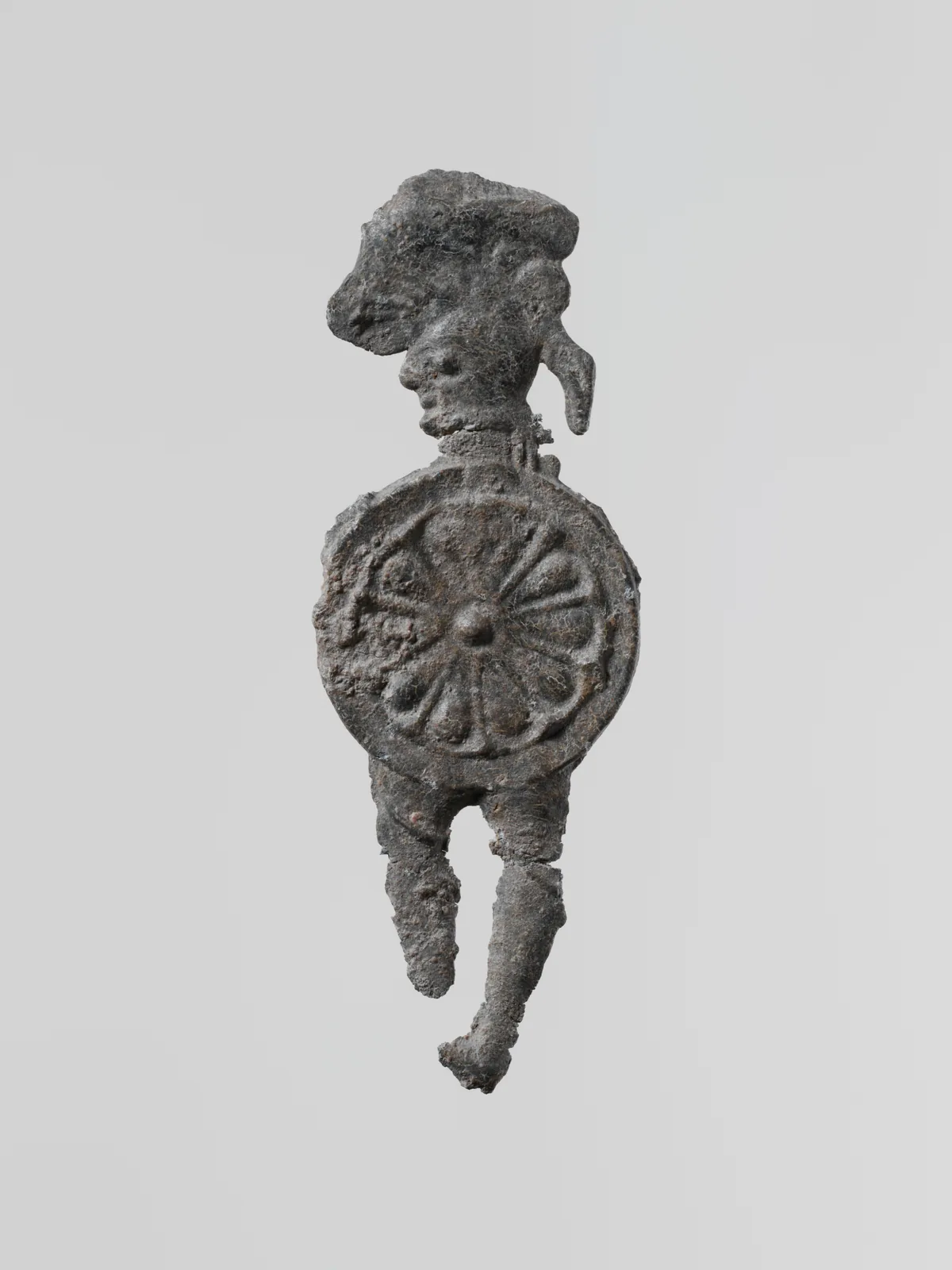 Lead figure of a warrior with a helmet and shield, Greek, Laconian