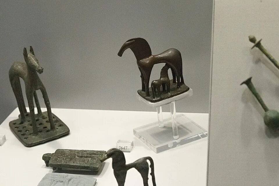 Geometric bronze horses. Photograph or reproduction of an ancient artifact.