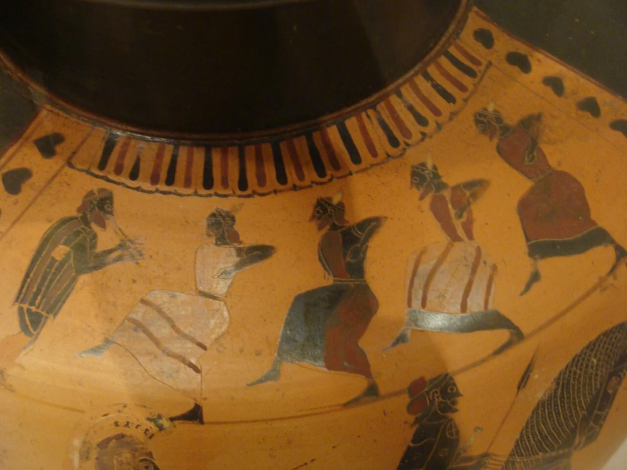 Aulos player and dancers on Attic pottery