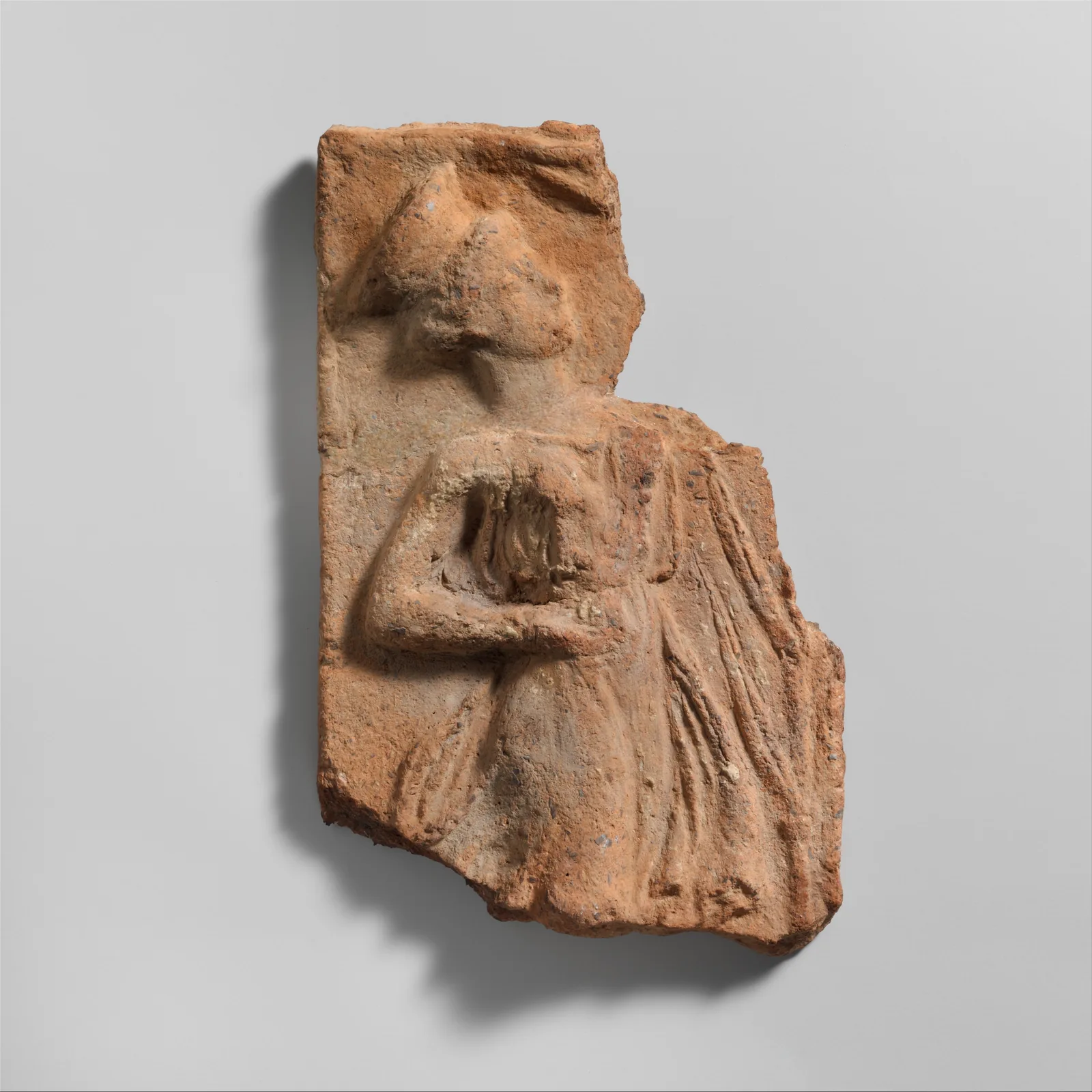 Fragment of a terracotta plaque, Greek