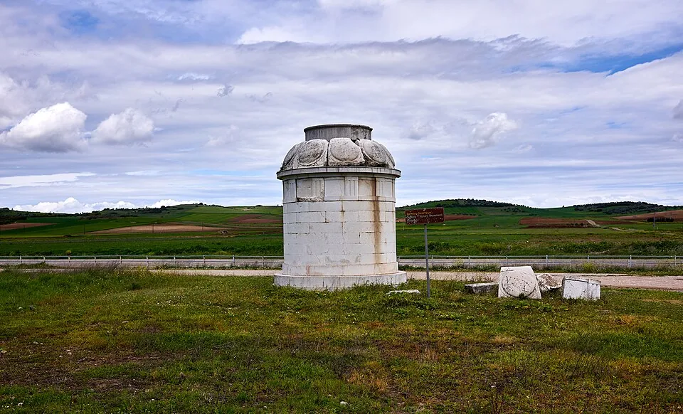 The restored Theban victory monument at Leuctra under a blue sky.