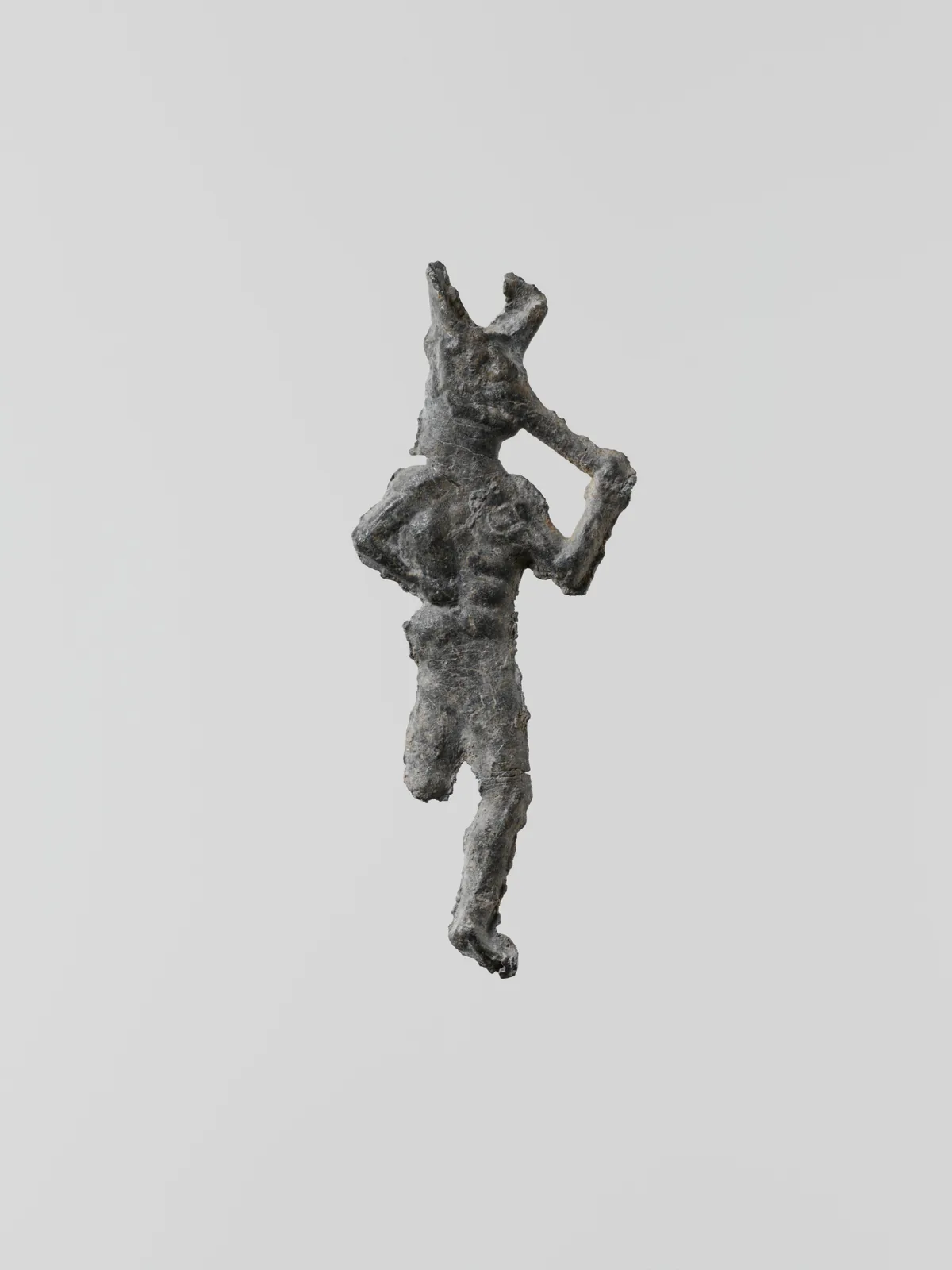 Lead figure of a flute-player, Greek, Laconian