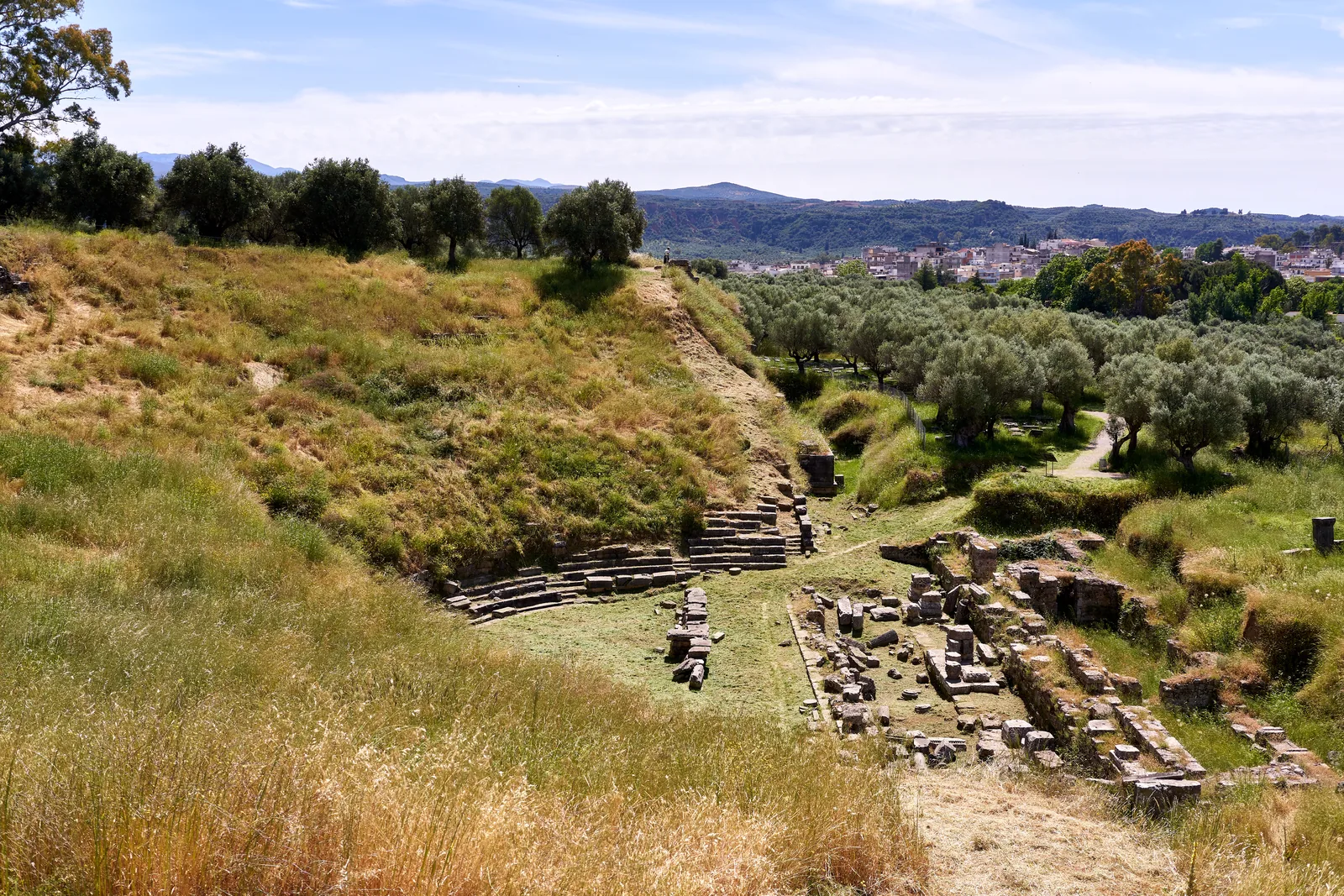 The ancient theatre of Sparta. Photograph of the surviving site or modern landscape.