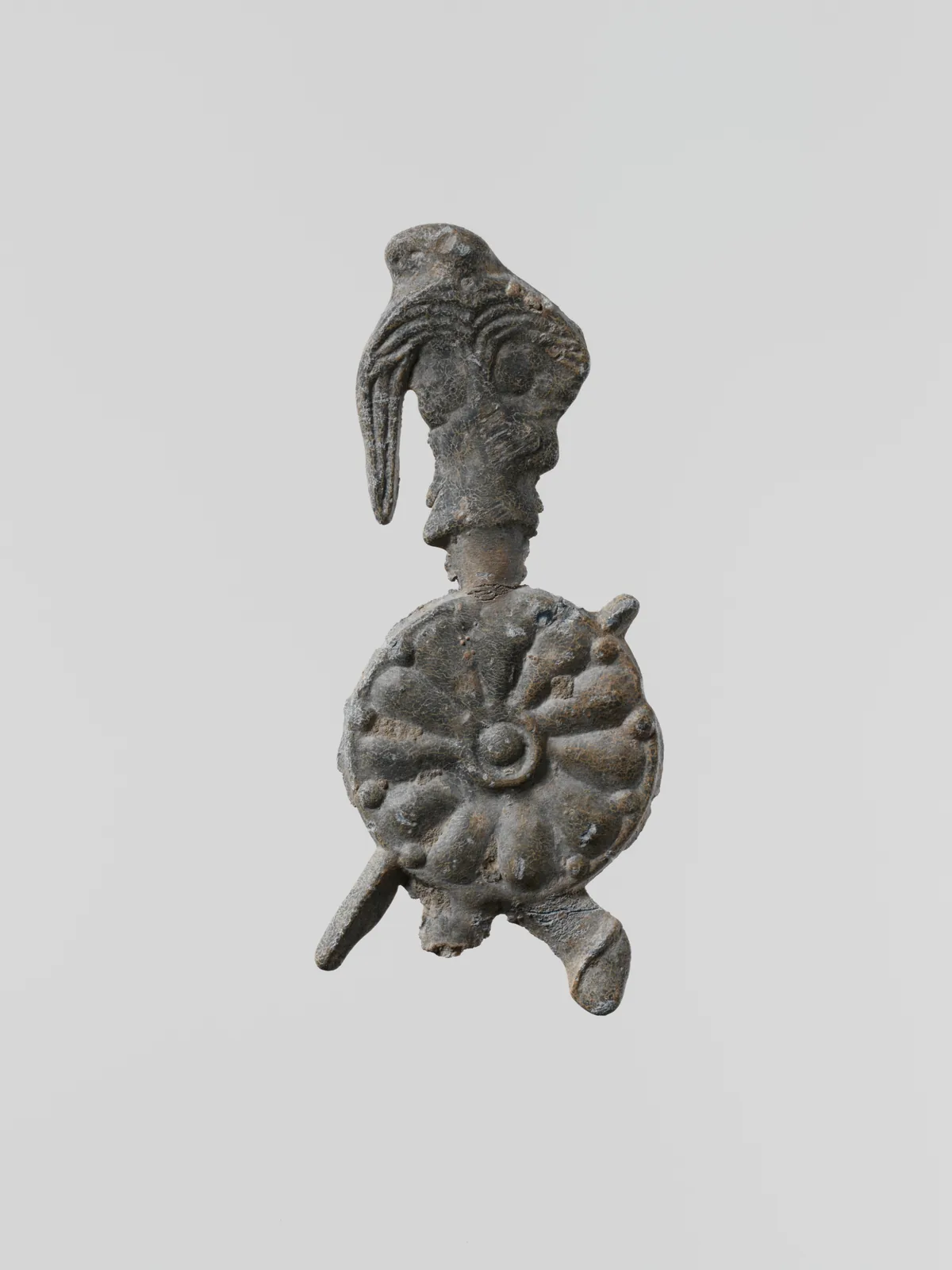 Lead figure of a warrior with a helmet, shield, and spear, Greek, Laconian